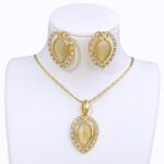 latest opal fashion jewelry for women in gold color, featuring a necklace and earrings set with water drop and heart pendant designs, perfect for brides, weddings, and party accessories.