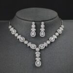 A stunning and elegant jewelry set designed for brides, including a necklace, earrings, and matching accessories.