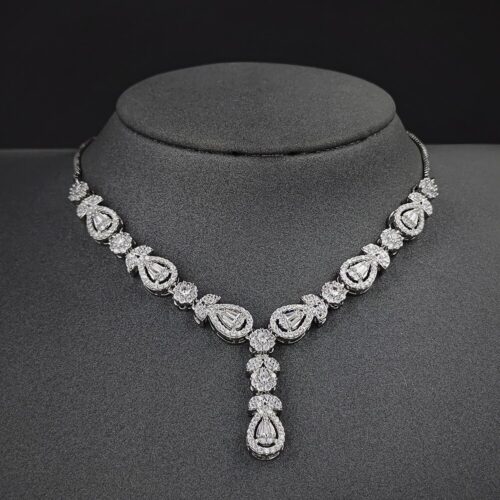A stunning and elegant jewelry set designed for brides, including a necklace, earrings, and matching accessories.