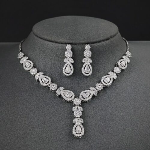 A stunning and elegant jewelry set designed for brides, including a necklace, earrings, and matching accessories.