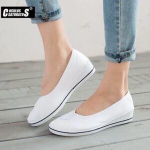 Women's soft slip-on canvas flats shoes in the style of loafers.