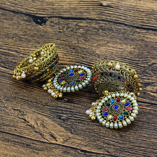 Earrings showcase a bohemian design with intricate gold plating and delightful bell accents, adding a touch of timeless charm to your style.