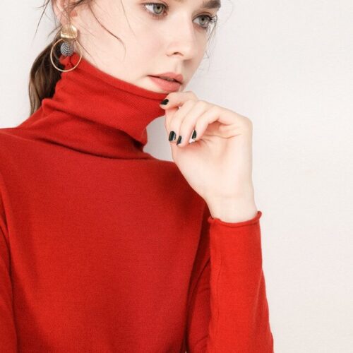 Women knitted high-neck sweater, a cozy and stylish winter garment.