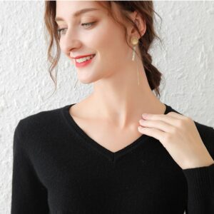 V-neck loose knitted pullover sweater for women a stylish and cozy winter top.