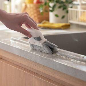 Handheld Groove Cleaning Brush, a tool for deep cleaning hard-to-reach areas.