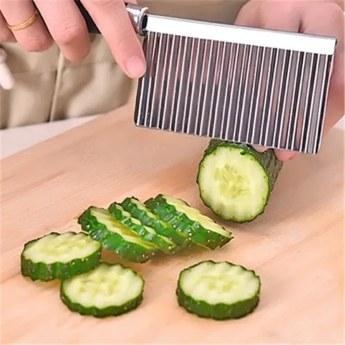 Potato wavy cutting tool for creating decorative and textured potato slices.