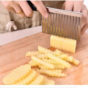 Potato wavy cutting tool for creating decorative and textured potato slices.