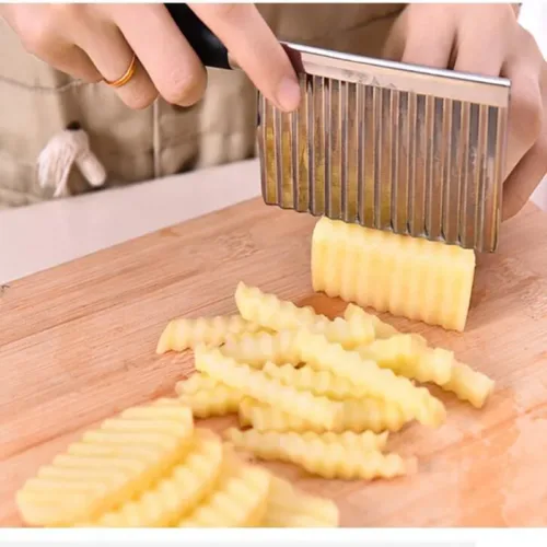 Potato wavy cutting tool for creating decorative and textured potato slices.