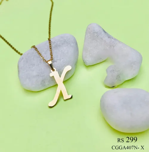 with a capital letter 'X' pendant. The pendant, intricately designed with filigree details, hangs elegantly from a slender chain, adding a touch of sophistication and personalization to the accessory.