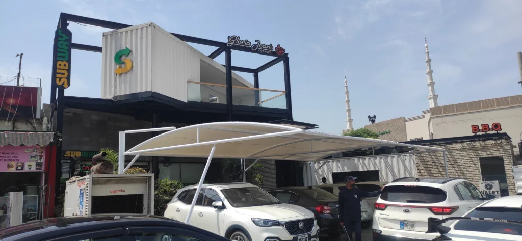 Discover the modern solution for car parking with our elegant tensile fabric sheds. Offering functionality and style, our innovative design provides shelter and protection for your vehicle while you can make outdoor seating arrangements for a Café or Restaurant bringing a touch of sophistication to any environment.