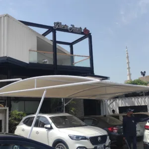 Discover the modern solution for car parking with our elegant tensile fabric sheds. Offering functionality and style, our innovative design provides shelter and protection for your vehicle while you can make outdoor seating arrangements for a Café or Restaurant bringing a touch of sophistication to any environment.