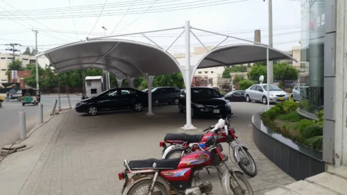 This Double-Sided Car Parking Shade has a tensile fabric top membrane to Shield Your Vehicle with Complete Coverage. Ideal for Outdoor Protection Against Sun, Rain, and Debris. Keep Your Car Safe and Secure with this Convenient Solution.