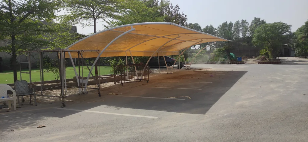 Car Parking Shade Solutions In Faisalabad Discover the modern solution for car parking with our elegant tensile fabric car parking shed. Offering functionality and style, our innovative design provides shelter and protection for your vehicle while adding a touch of sophistication to any environment.